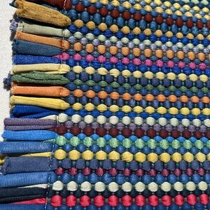 Colorful Woven Rug with Tassels.